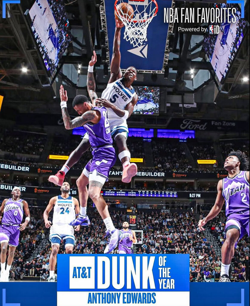 Anthony Edwards of the Minnesota Timberwolves dunks over Utah Jazz defenders during an NBA game, a fan-voted NBA Dunk of the Year moment.