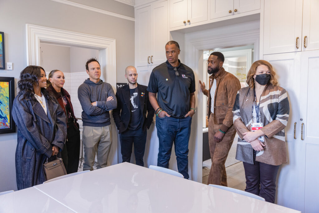 kids from the encircle house speak to Dwyane Wade and Gabrielle Uniond during their visit to the  Encircle House.