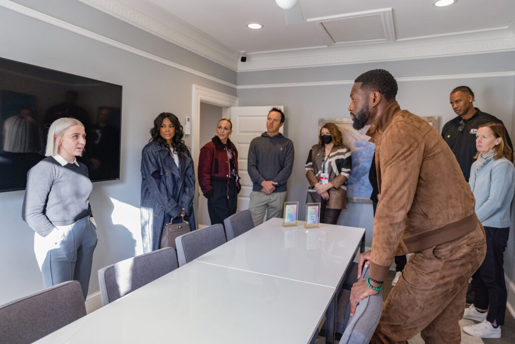 kids from the encircle house speak to Dwyane Wade and Gabrielle Uniond during their visit to the  Encircle House.