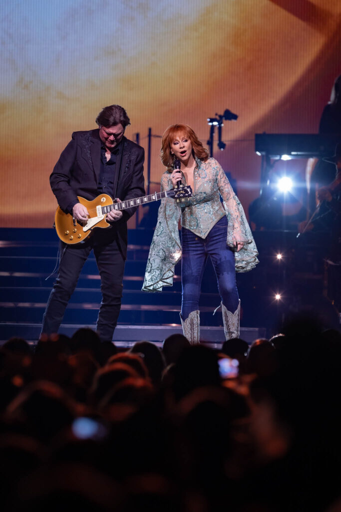 Reba McEntire performing live in concert during a country music stage performance