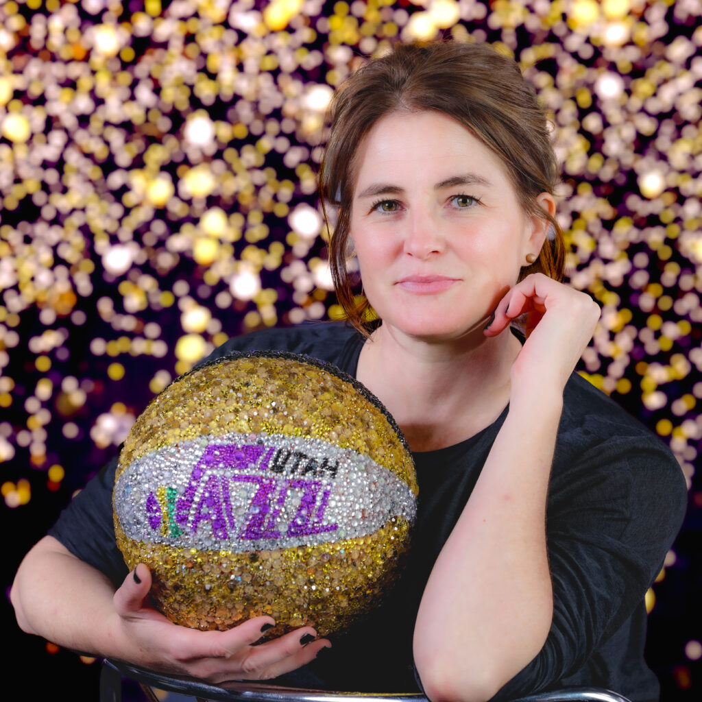 Portrait of photographer Melissa Majchrzak, the Utah Jazz NBA Team Photographer. Majchrzak specializes in sports, corporate, event, and editorial photography with more than 25 years of professional experience.